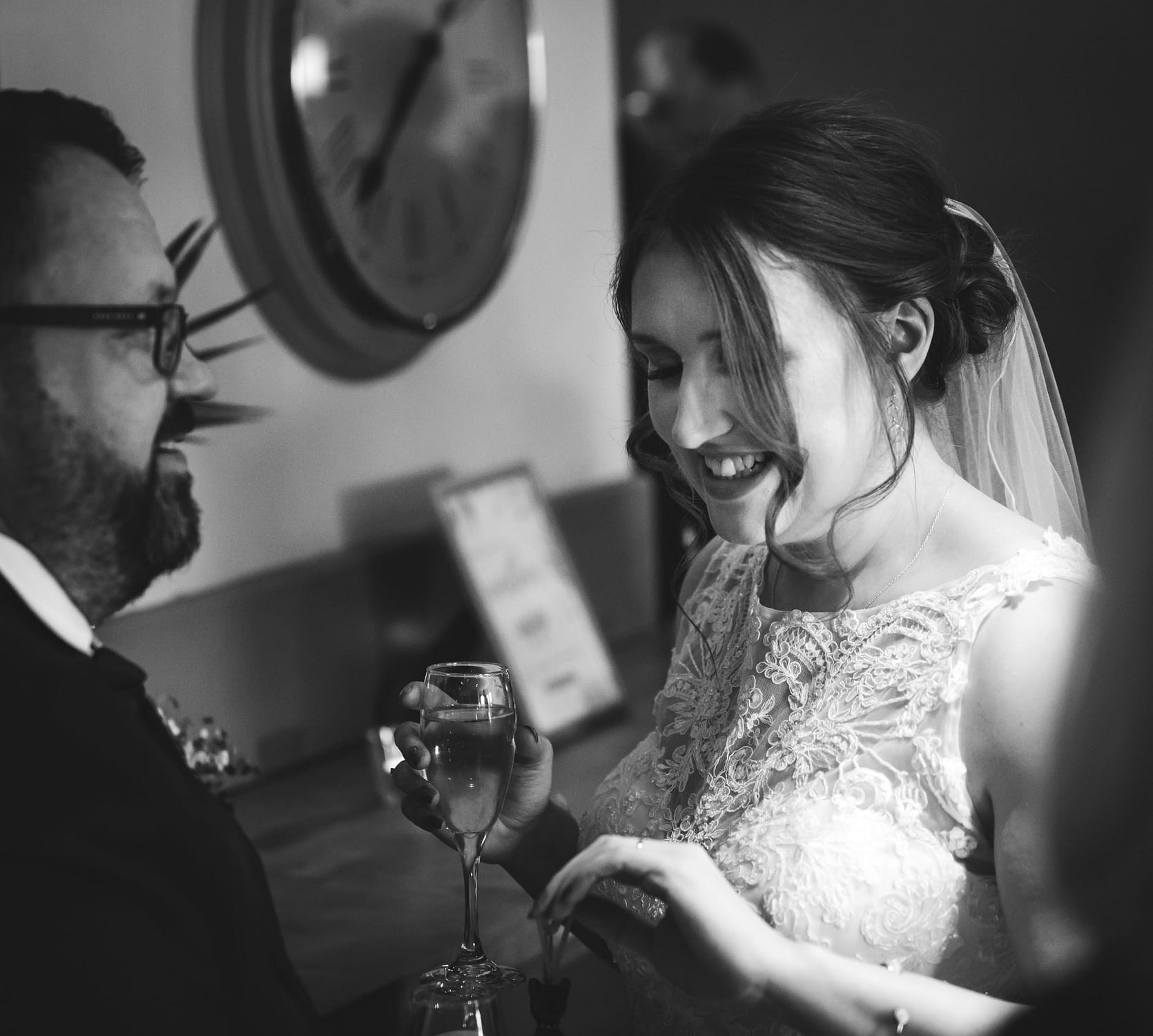 black and white picture of wedding guests chatting together