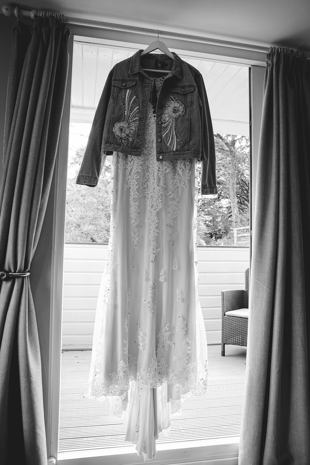 wedding gown hanging in doorway