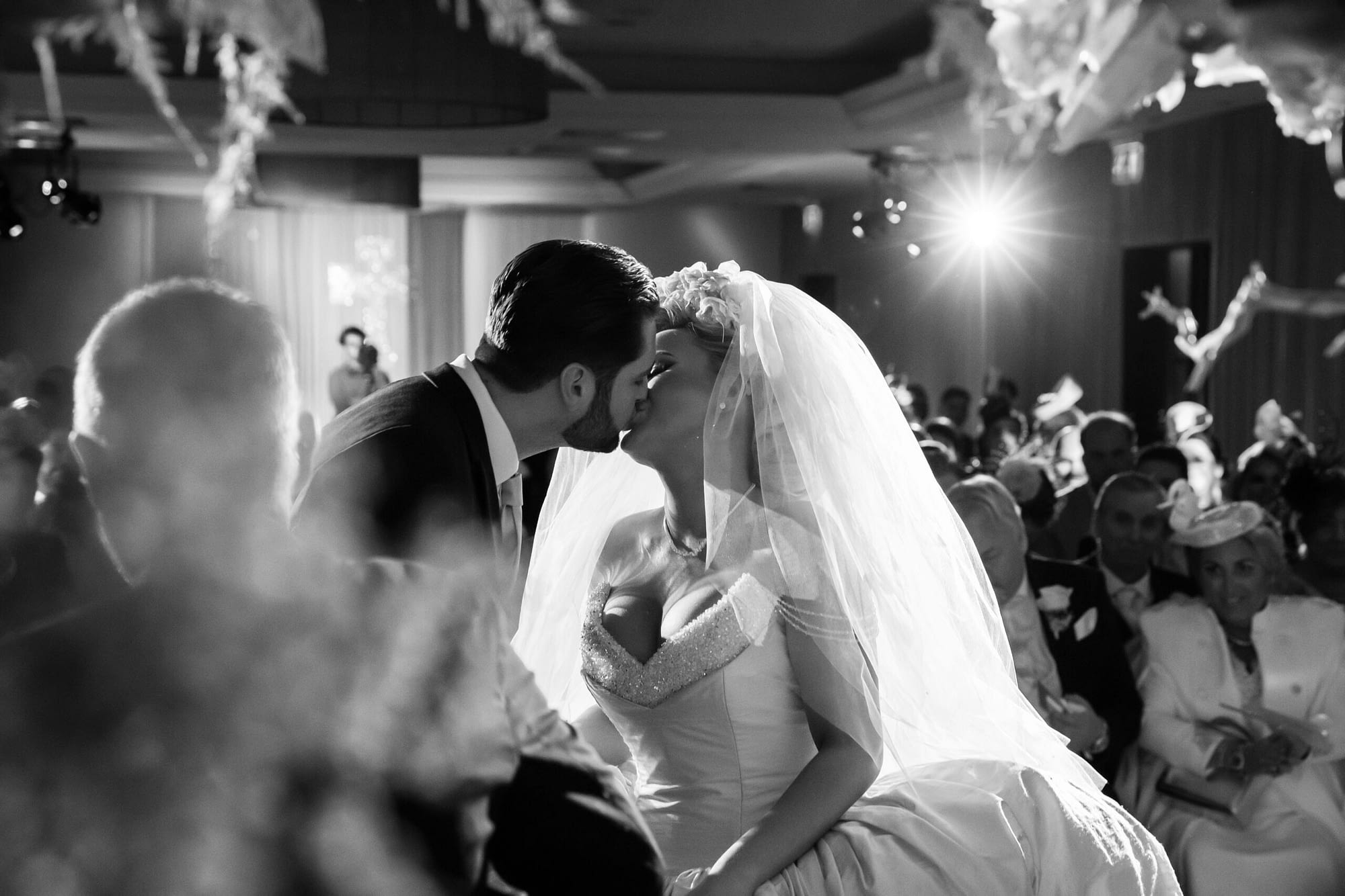 bride and groom kissing each other