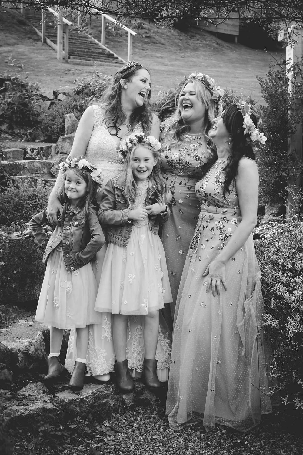 bride and bridesmaids laughing together