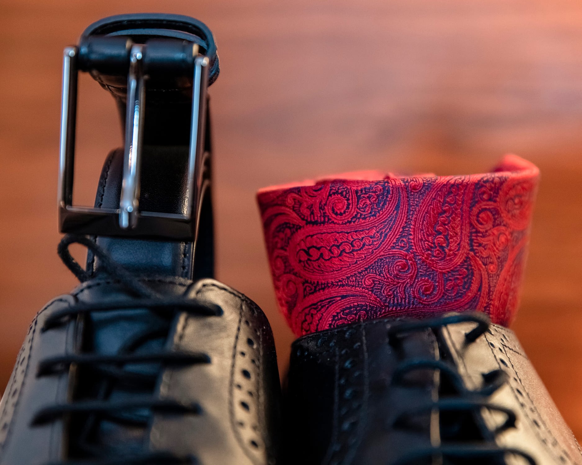 men's shoes, belt and red handkerchief 