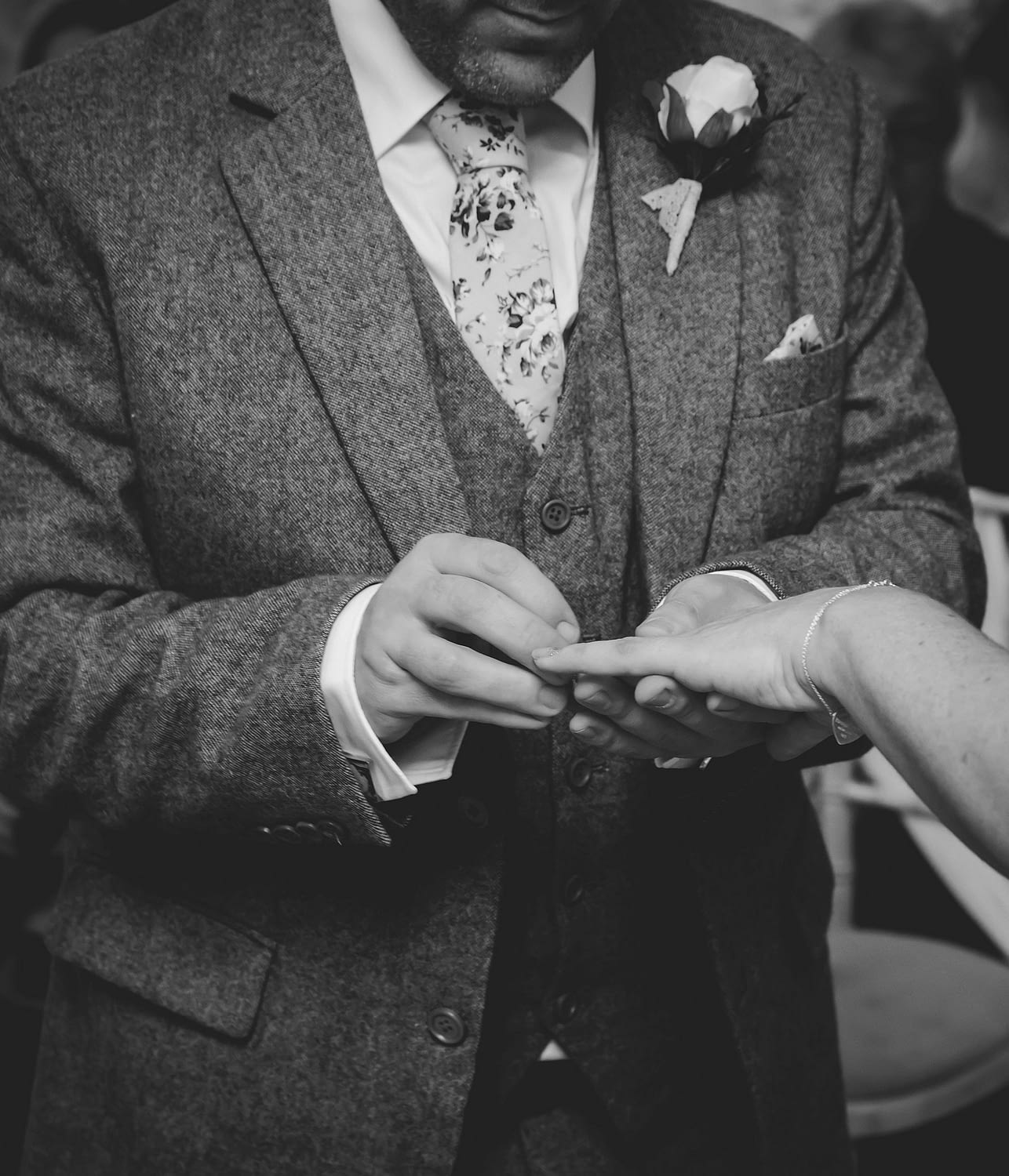groom places ring on bride's finger